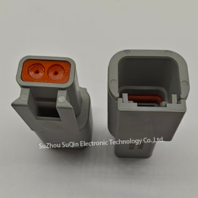Close-up detail of the two male pin contacts and IP67 silicone seal on the Deutsch ATM04-2P connector